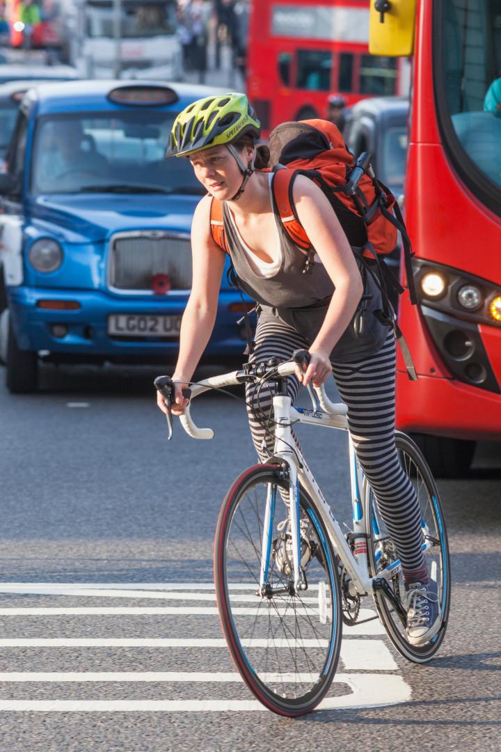 England, London, City of London, Cyclist in Traffic